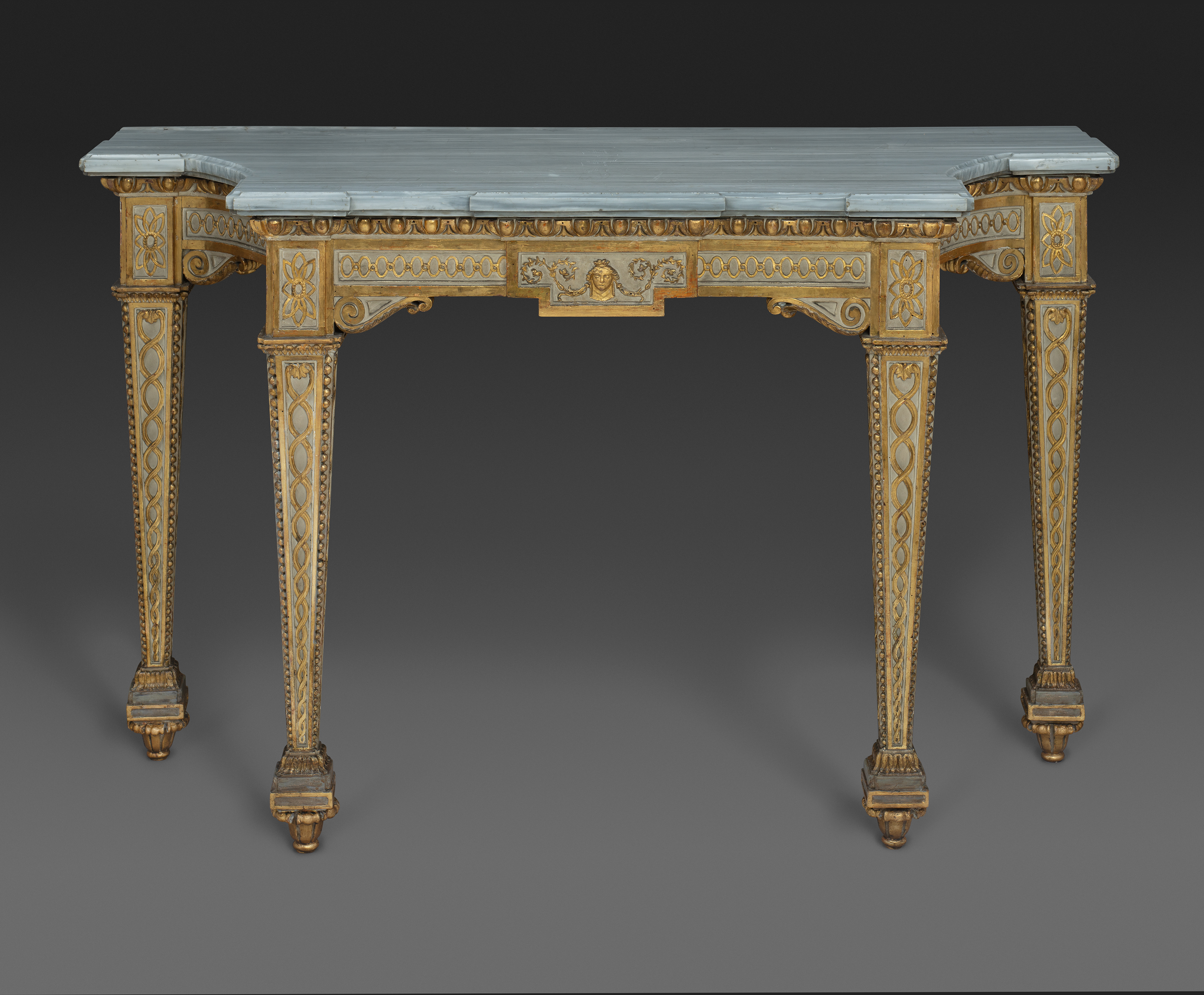 A North-Italian neoclassical creme painted and microcarved parcel gilt-walnut console table with original Grey Valdieri marble top, Turin, 1790 circa
